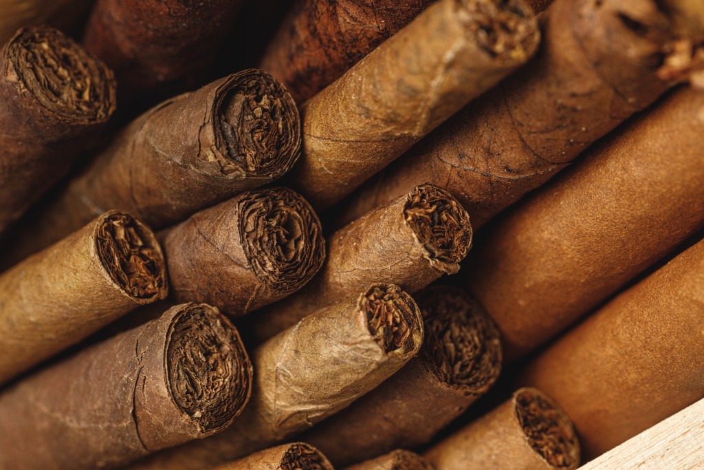 pile-of-new-cigars-close-up-on-wooden-table-2023-11-27-04-59-52-utc.jpg
